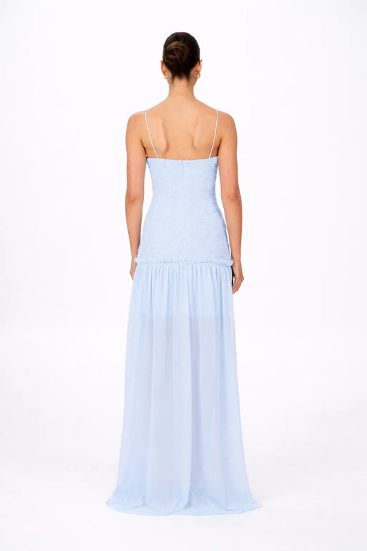 Back view of baby blue maxi dress showing open back design with thin straps and fitted waist detail