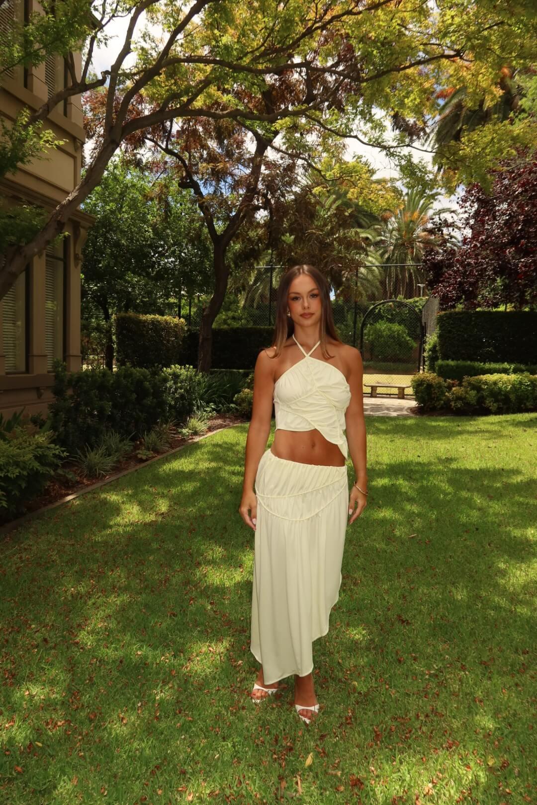Close-up of the Koster Kulture Fleur Top and Skirt Set in cream highlighting the neckline, fabric texture and premium detailing