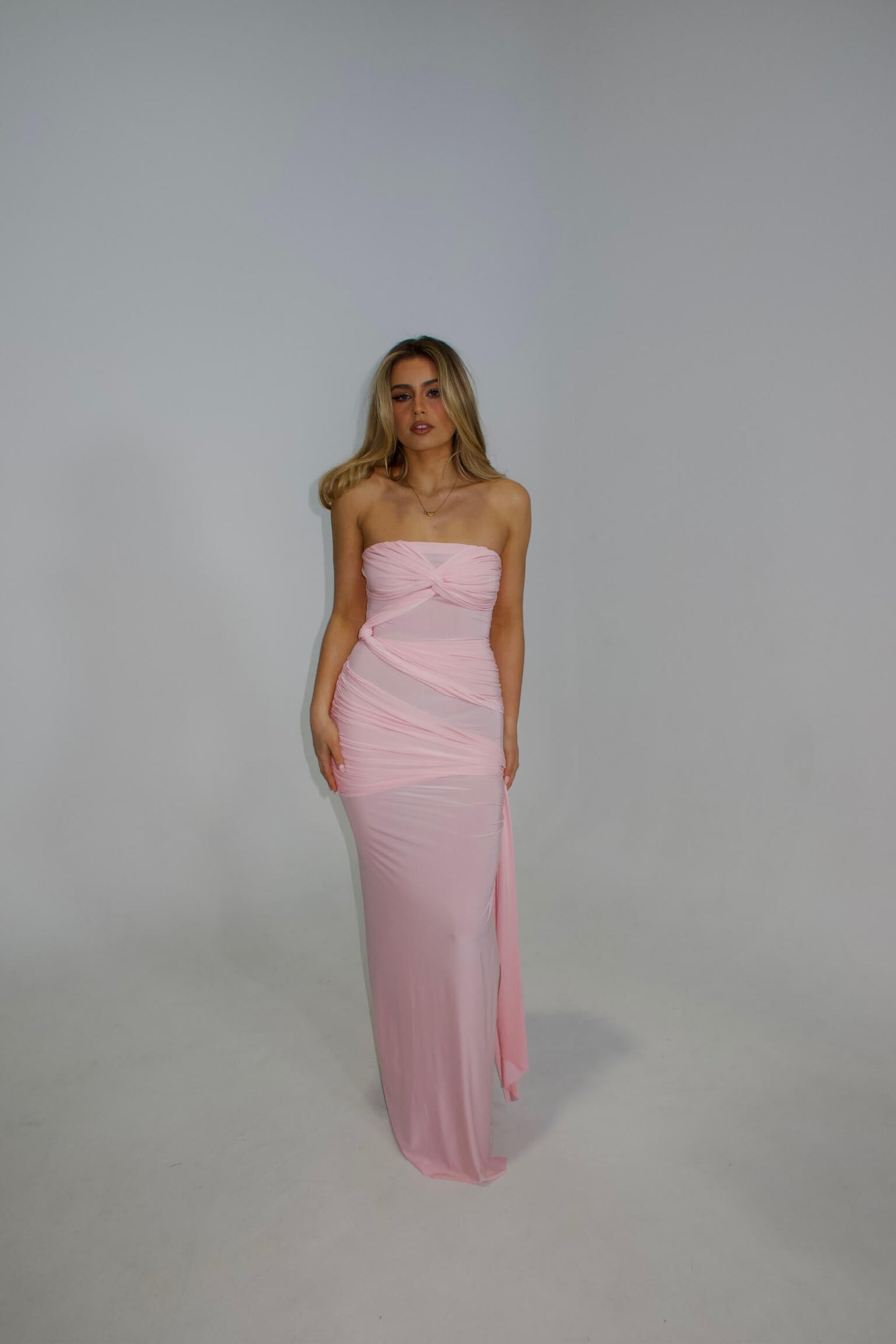 Natalie Rolt Miranda Gown in blossom pink featuring an elegant full-length silhouette and flowing design