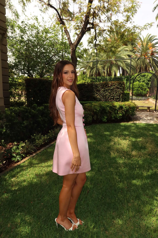 Side view of Rebecca Vallance Aymee Mini Dress in soft pink with sculpted tulip skirt