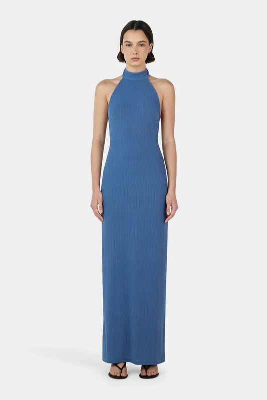 Turlington Maxi Dress in marina blue featuring halter neckline, fitted bodice and flowing floor length silhouette with elegant draped fabric
