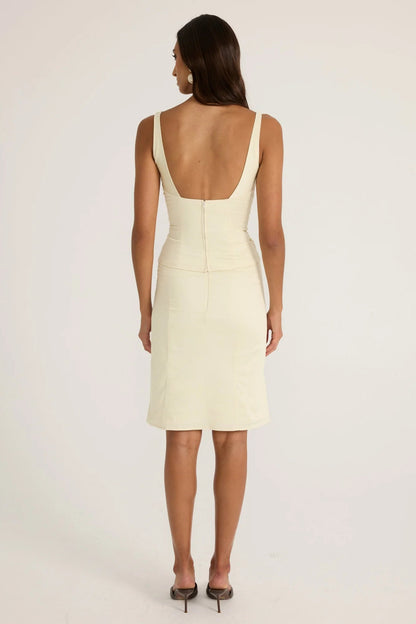 Back view of the Ance Gria Atlein Midi Set in cream featuring a fitted long sleeve top, matching midi skirt and clean minimalist silhouette