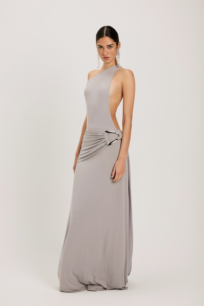Ance Gria Gaia Gown in silver grey featuring strapless neckline, structured bodice and elegant floor length fitted silhouette with soft metallic sheen