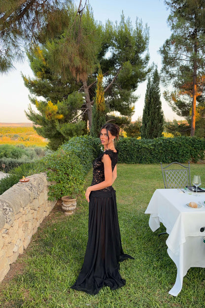 Side view of the Arcina Ori Arabella black formal dress showcasing the fitted lace bodice and flowing sheer skirt, available from Adelaide with express shipping across Australia.