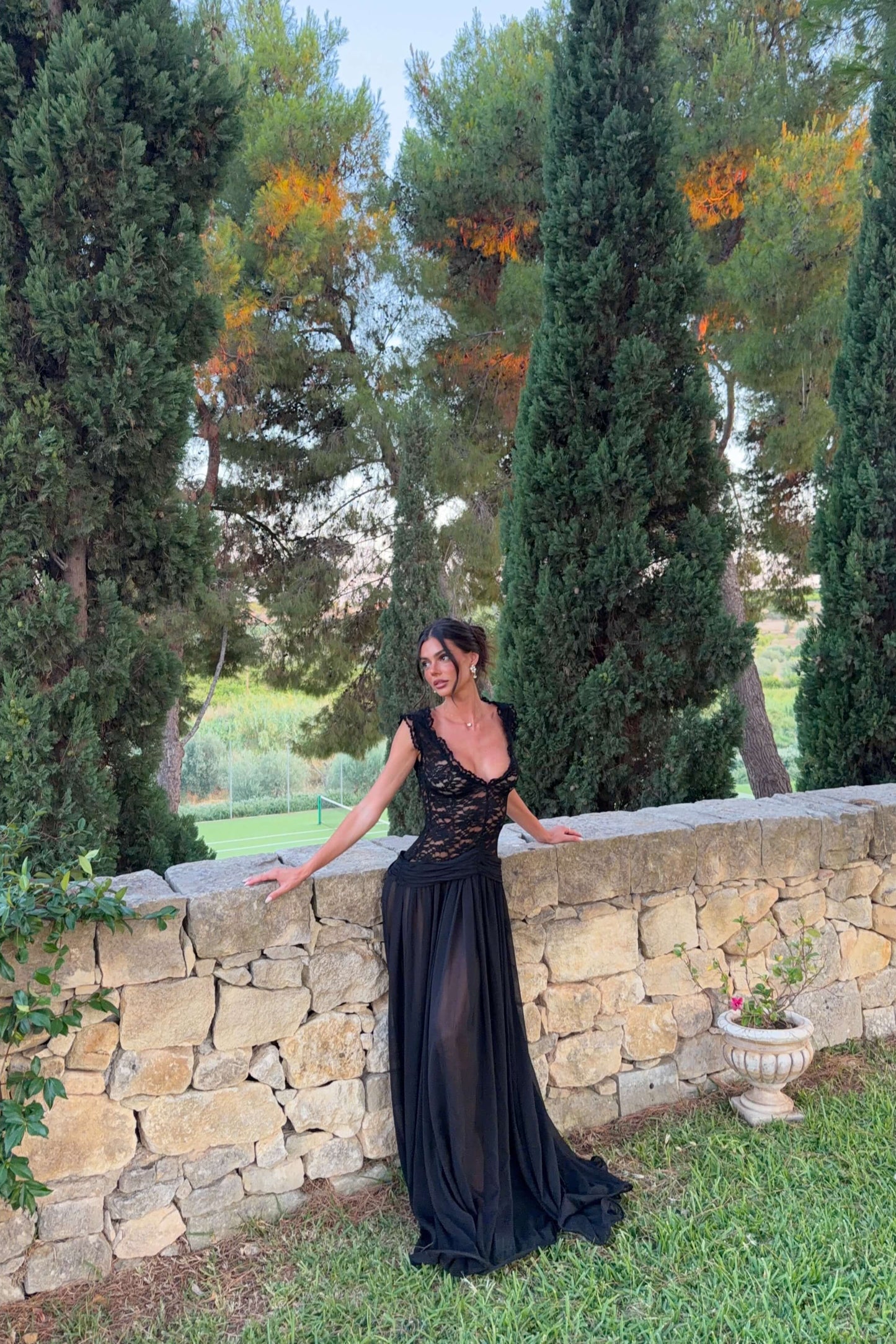 Arcina Ori Arabella black dress in motion showing the flowing sheer maxi skirt, available for formal and event dress hire in Adelaide with express shipping Australia-wide.