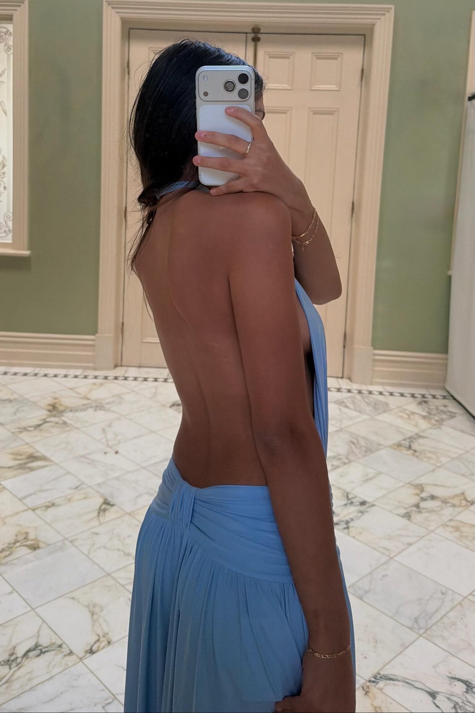 Arcina Ori Santina Maxi Dress in sky blue showcasing the elegant back design and flowing maxi silhouette