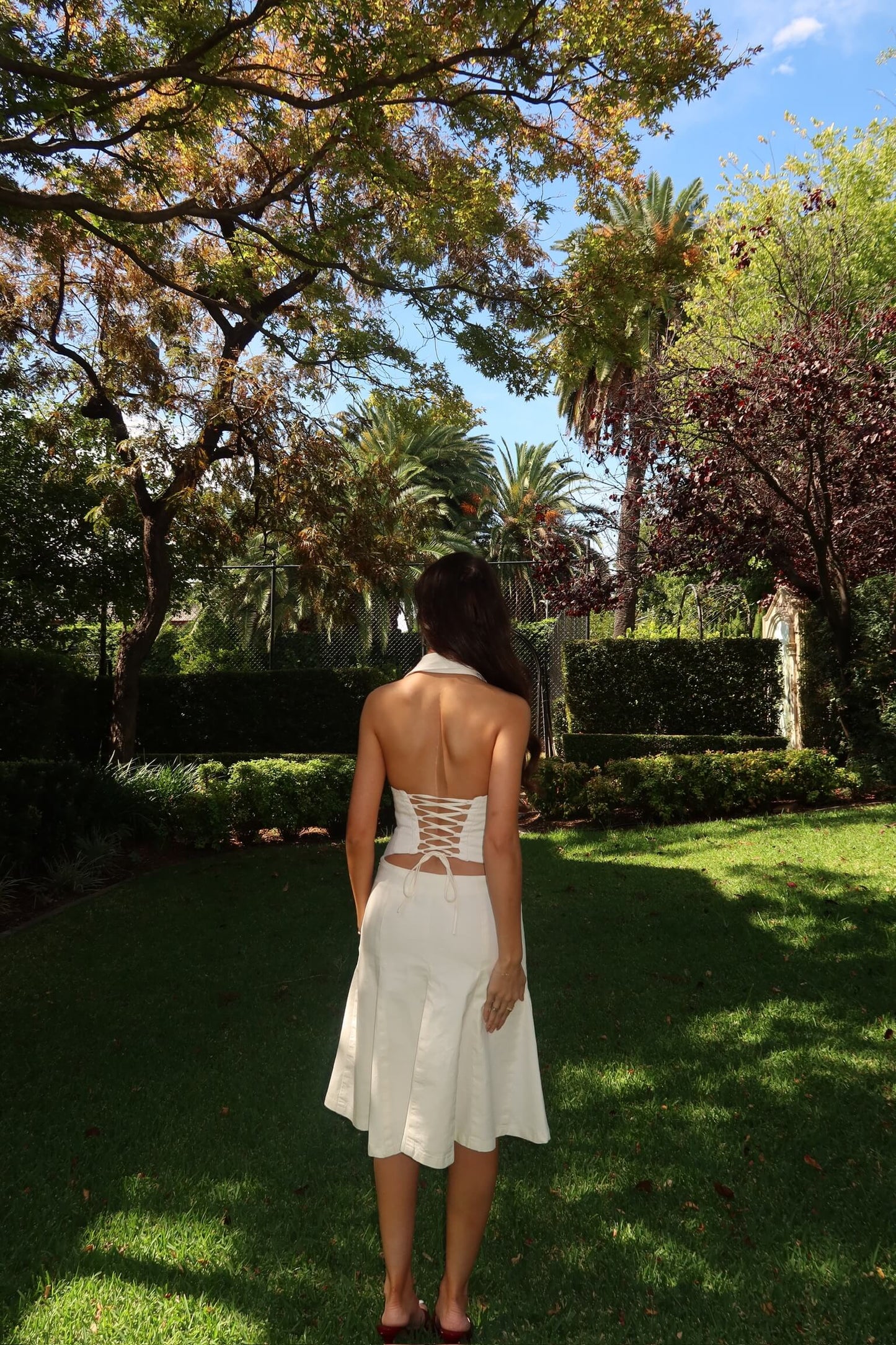 Asa Fields The Naomi Set in white available for dress hire in Adelaide, Australia, featuring a structured corset-style top and matching skirt for a modern designer look.