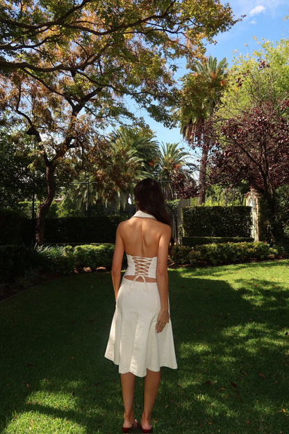 Asa Fields The Naomi Set in white available for dress hire in Adelaide, Australia, featuring a structured corset-style top and matching skirt for a modern designer look.