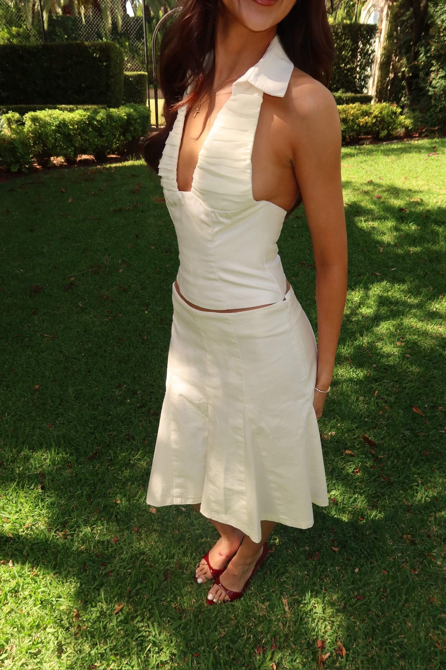 Side view of Asa Fields The Naomi Set in white showing the corset top and fitted skirt silhouette, available for dress hire in Adelaide and Australia.