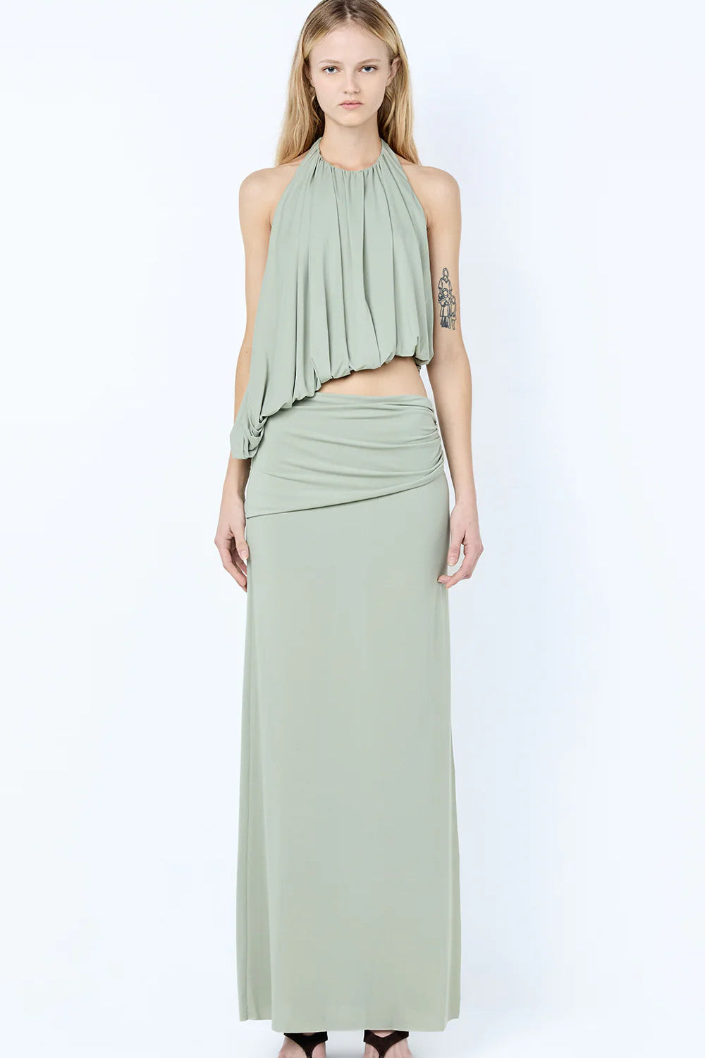 Bec & Bridge Cadence Racer Maxi Dress in pistachio green featuring a halter neckline, gathered bodice and floor length silhouette