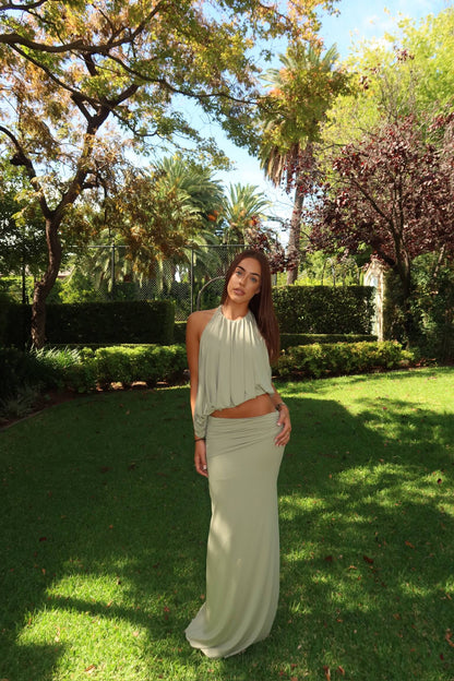 Bec & Bridge Cadence Racer Maxi Dress in pistachio green available for dress hire in Adelaide, Australia, featuring a halter neckline and elegant fitted maxi silhouette.