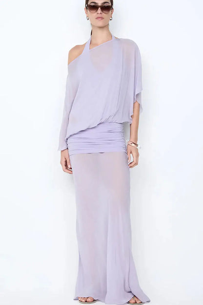 Bec & Bridge Delilah Overlay Maxi Dress in purple featuring halter neckline, sheer overlay detailing and elegant floor length silhouette with soft draped fabric
