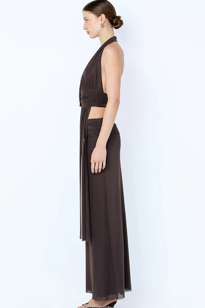 Side profile of brown Bec & Bridge set showing fitted drape top and flowing maxi skirt silhouette