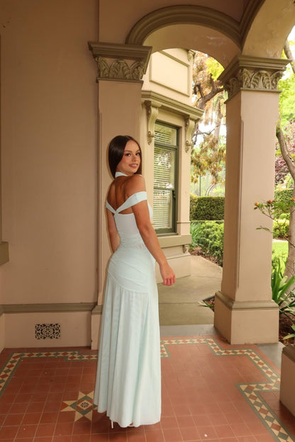 Side view of the BEC + BRIDGE Winnie Halter Maxi Dress in spearmint showcasing the elegant drape and flowing maxi silhouette