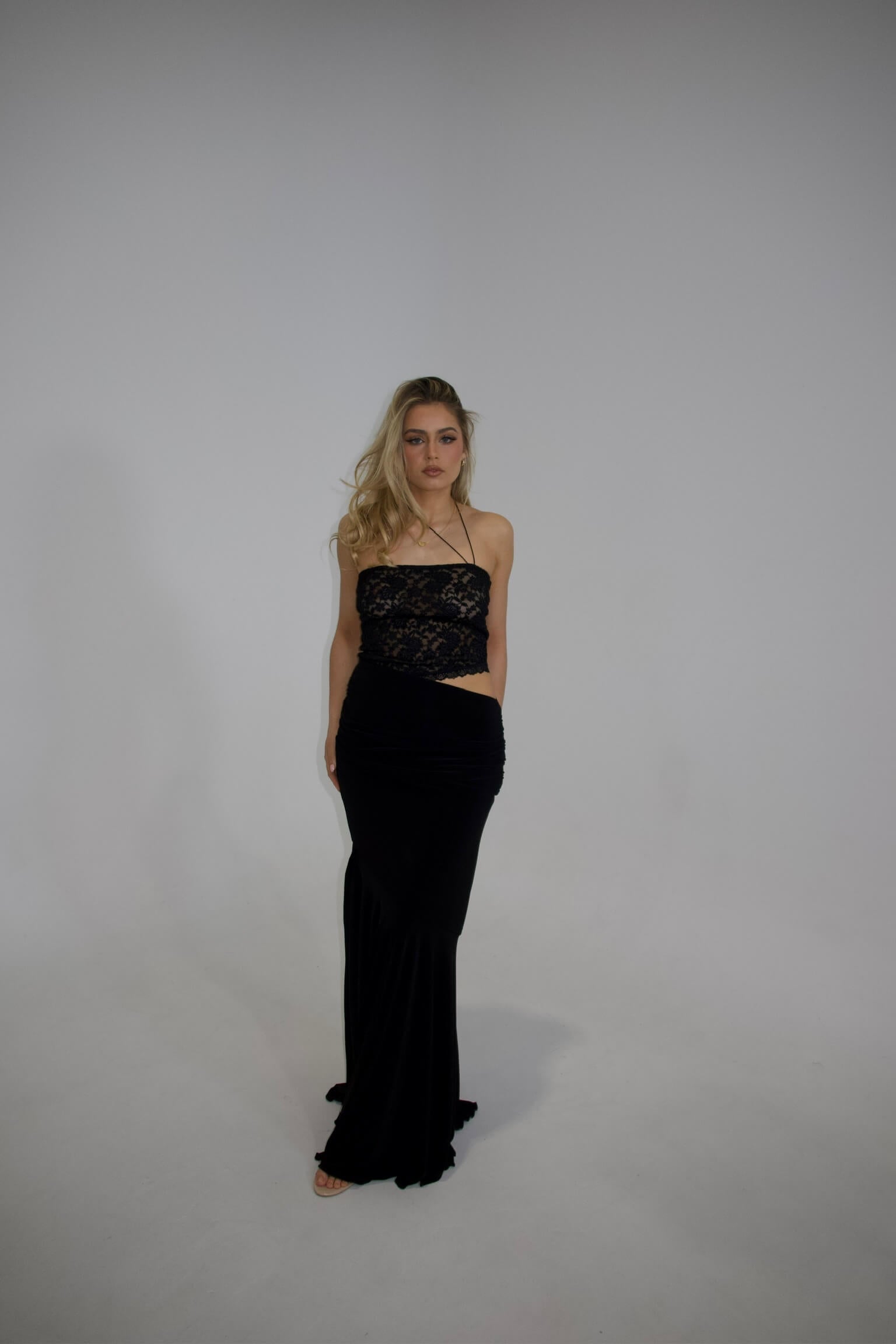 Deconduarte Ilona Maxi Dress in black featuring a sophisticated full-length silhouette and elegant evening design
