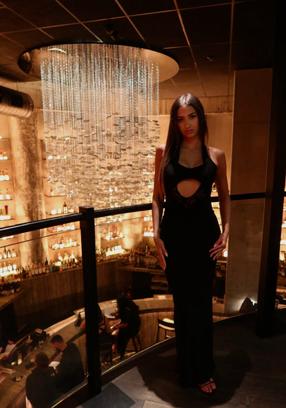 Deconduarte Mia Vita Maxi Dress in black featuring a sleek full-length silhouette and elegant evening design