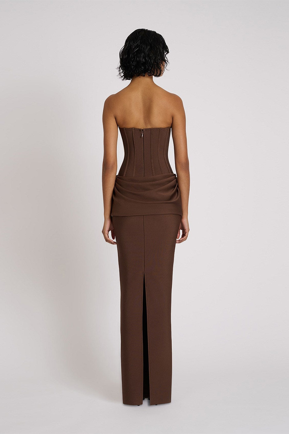 Back view of Eliya The Label Hilda Gown in chocolate showing structured corset fit and smooth elegant finish with floor length silhouette