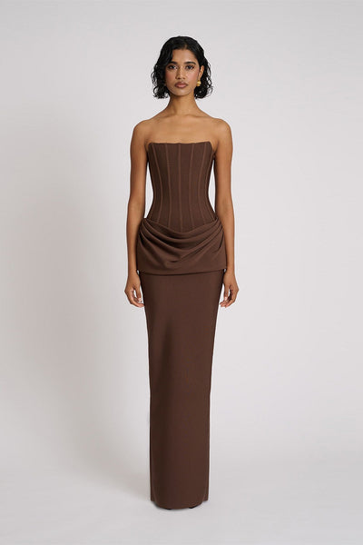 Eliya The Label Hilda Gown in chocolate featuring strapless neckline, structured corset bodice and elegant floor length silhouette with soft draped fabric