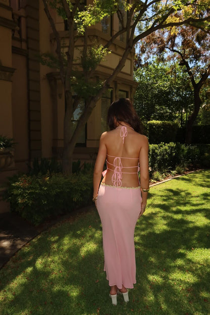 I Am Delilah Jemima Set in baby pink showcasing the elegant back design and coordinated two-piece silhouette