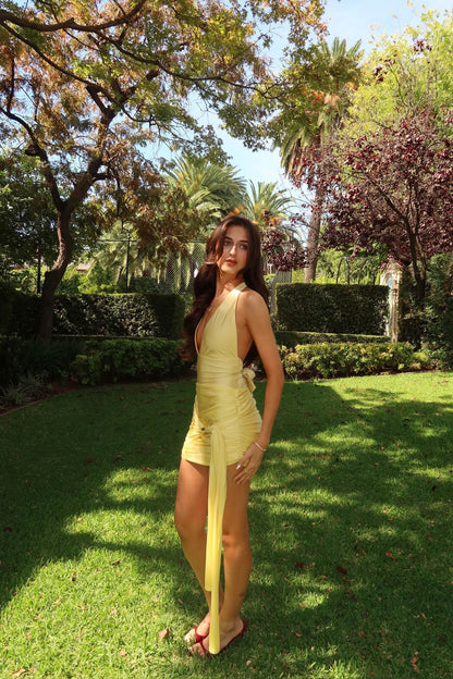 Side view of Imana Swim Kora Set in lemon showing the halter neckline, sculpted fit and mini skirt overlay, available for designer dress hire in Adelaide and Australia.