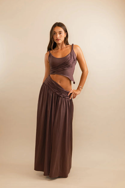 Plum co-ord set with twisted strap crop top and diagonal ruched detailing through sculpted bodice