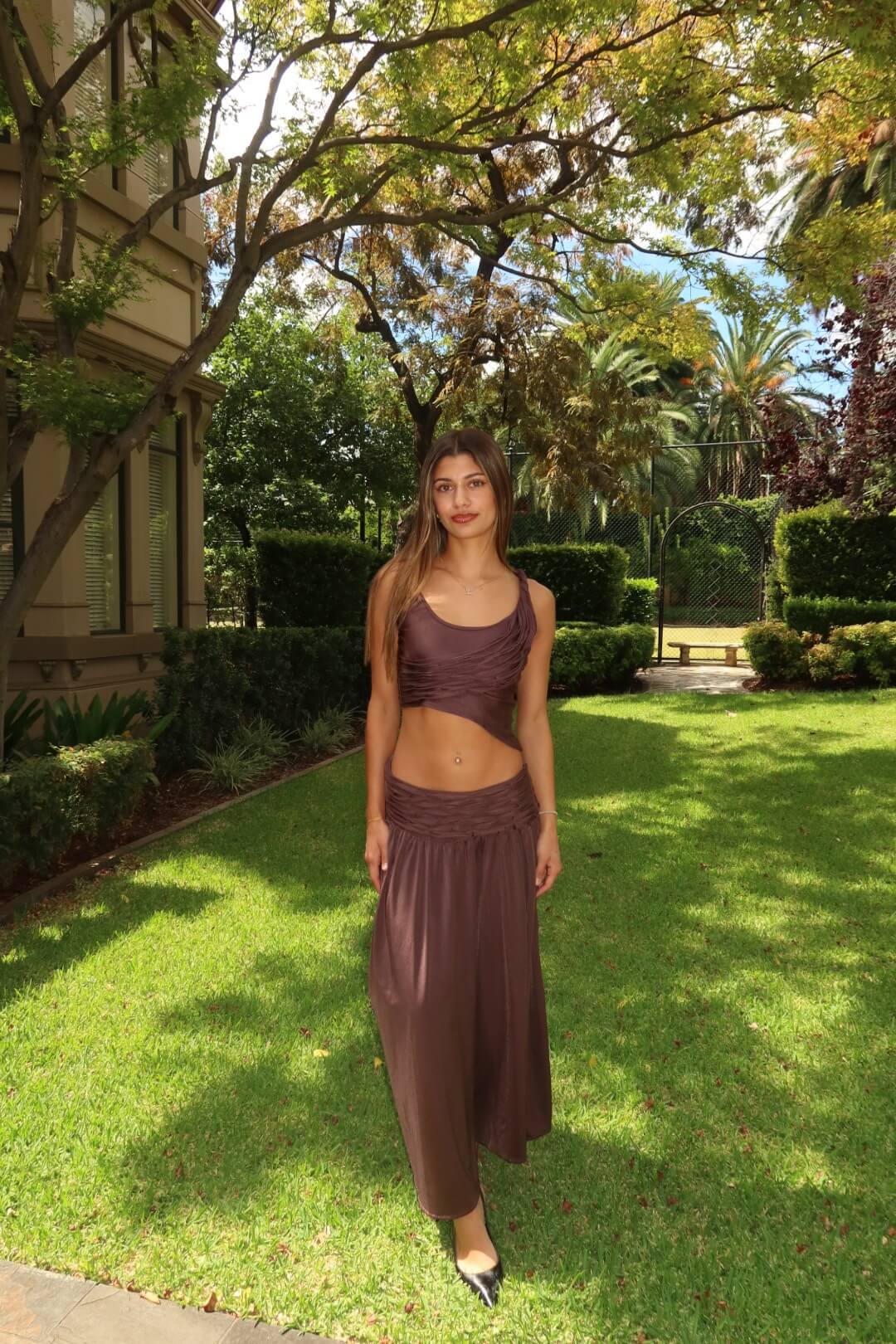 Koster Kulture Calypso Set in plum featuring a coordinated top and skirt with an elegant full-length silhouette