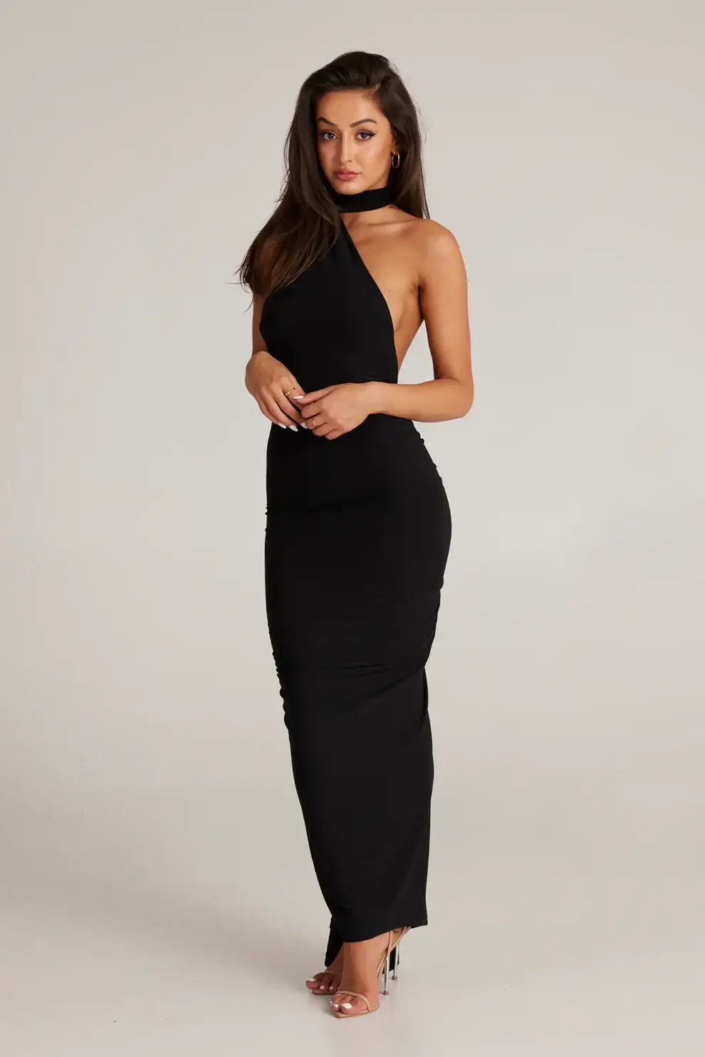Close detail of waist on black Leoni dress showing body contouring stretch fabric and sleek tailored fit