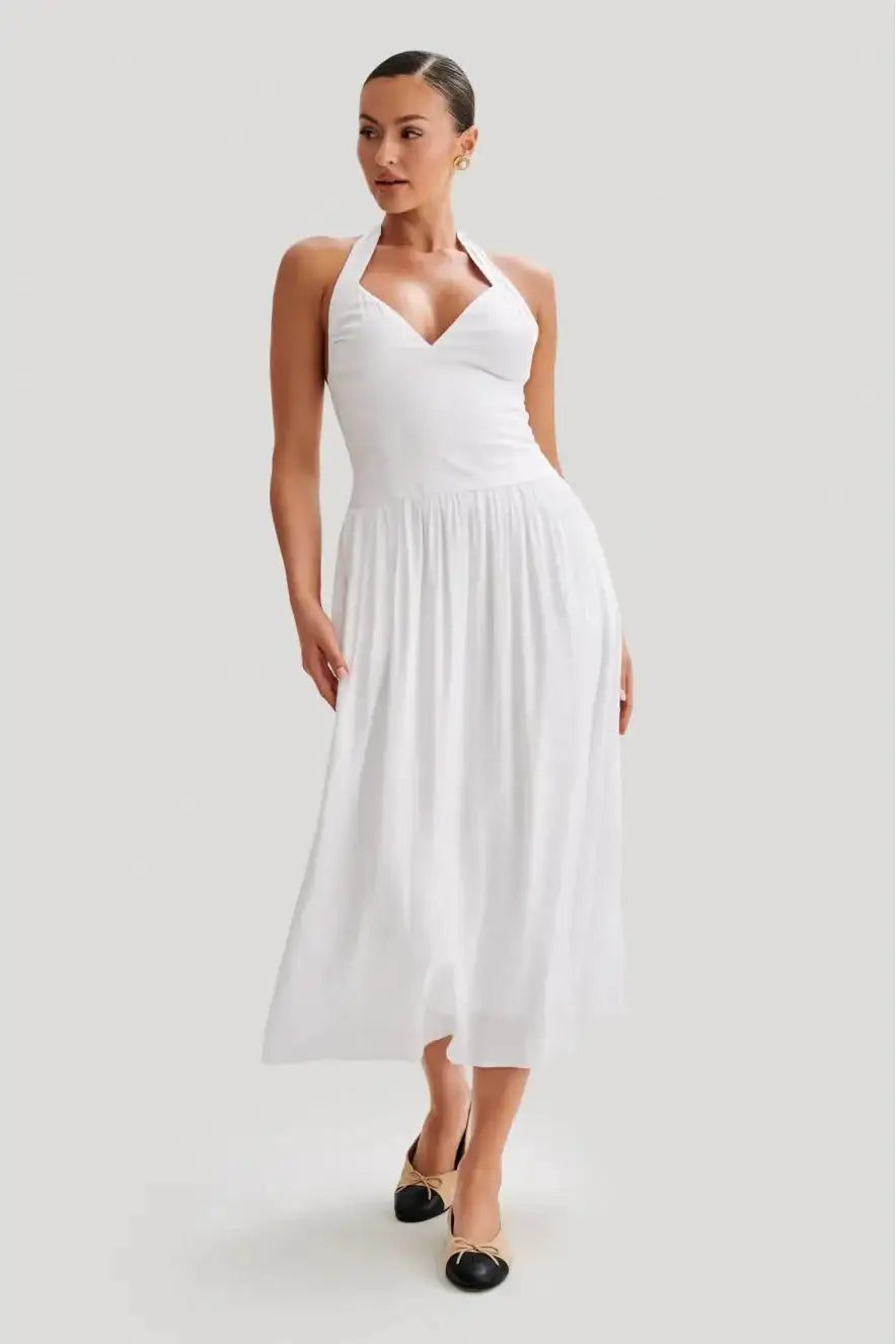 Meshki Harriette Halter Midi Dress in white featuring V neckline, halter strap design, fitted waist and flowing midi skirt with soft gathered detailing