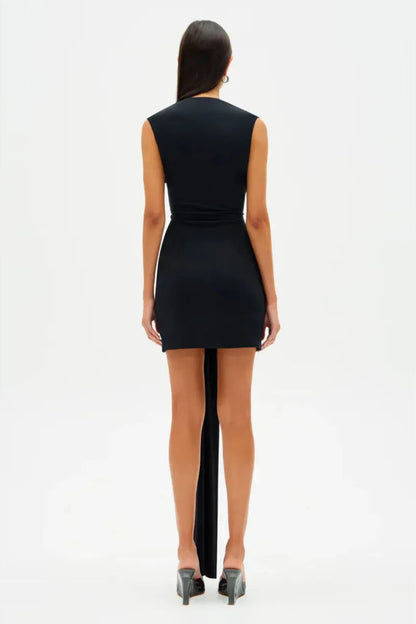 Close up of plunging halter neckline and fitted bodice on Misha Jennifer mini dress in black with soft draped cupro fabric