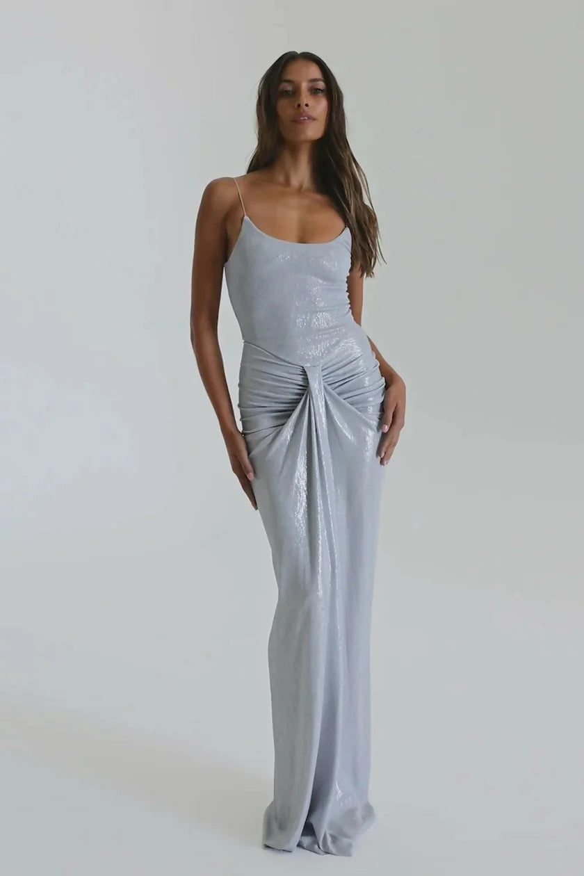 Close detail of waist on silver Allora gown showing gathered draping and fluid metallic fabric that contours the silhouette