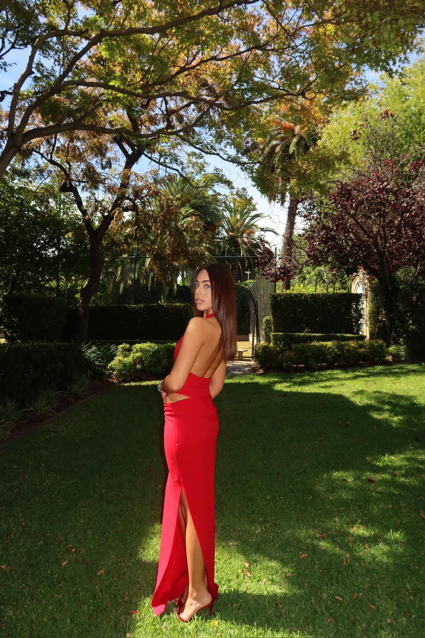Natalie Rolt Becca Set in cherry red showcasing the elegant back design and maxi skirt silhouette
