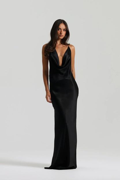 Natalie Rolt Gabi Gown in black featuring bias cut silk fabric, asymmetrical draped neckline and elegant floor length silhouette with soft fluid finish