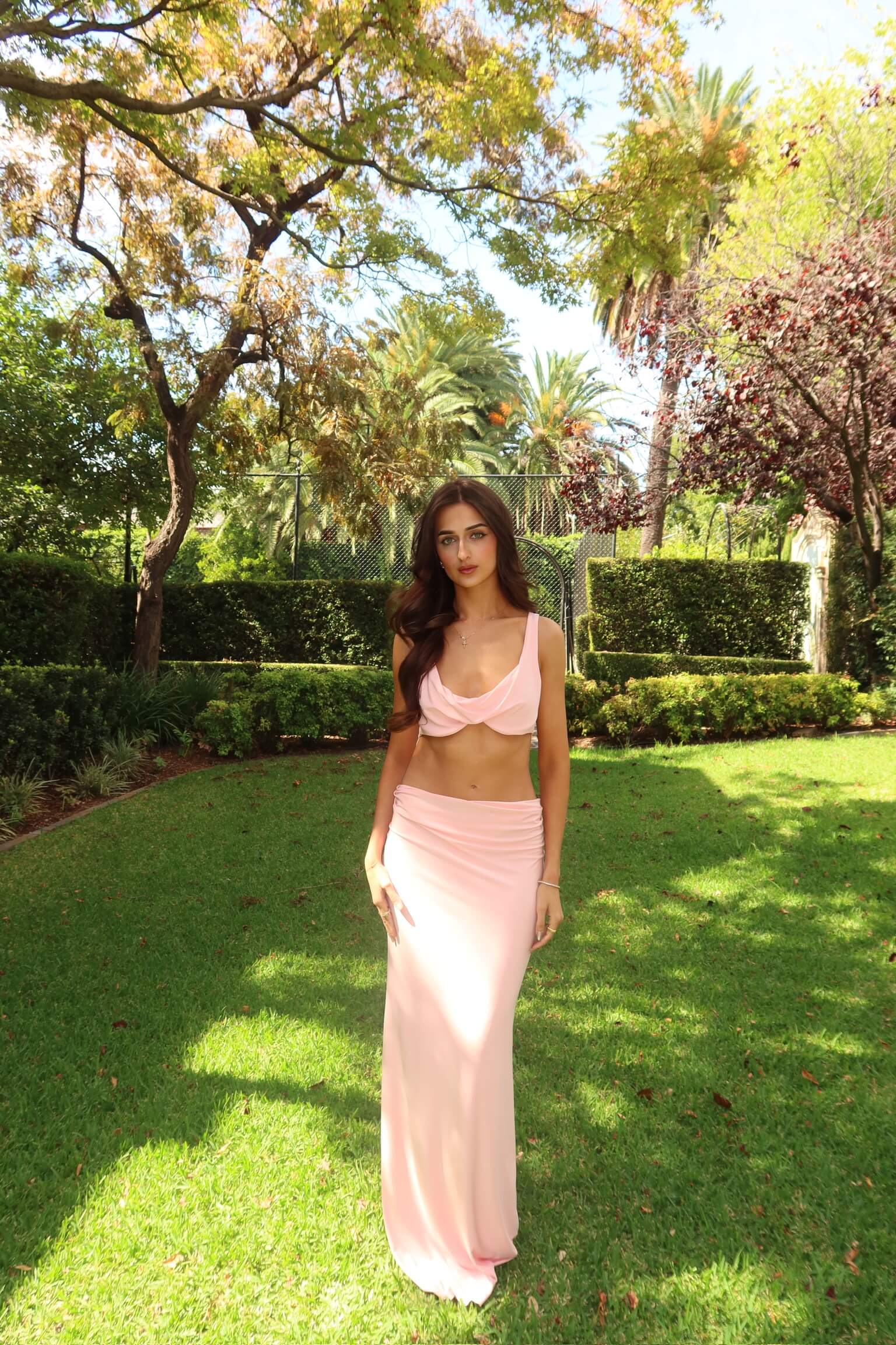 Natalie Rolt Inez dress in pink featuring a fitted silhouette and elegant drape, available for dress hire in Adelaide, Australia for weddings, formals and special occasions.