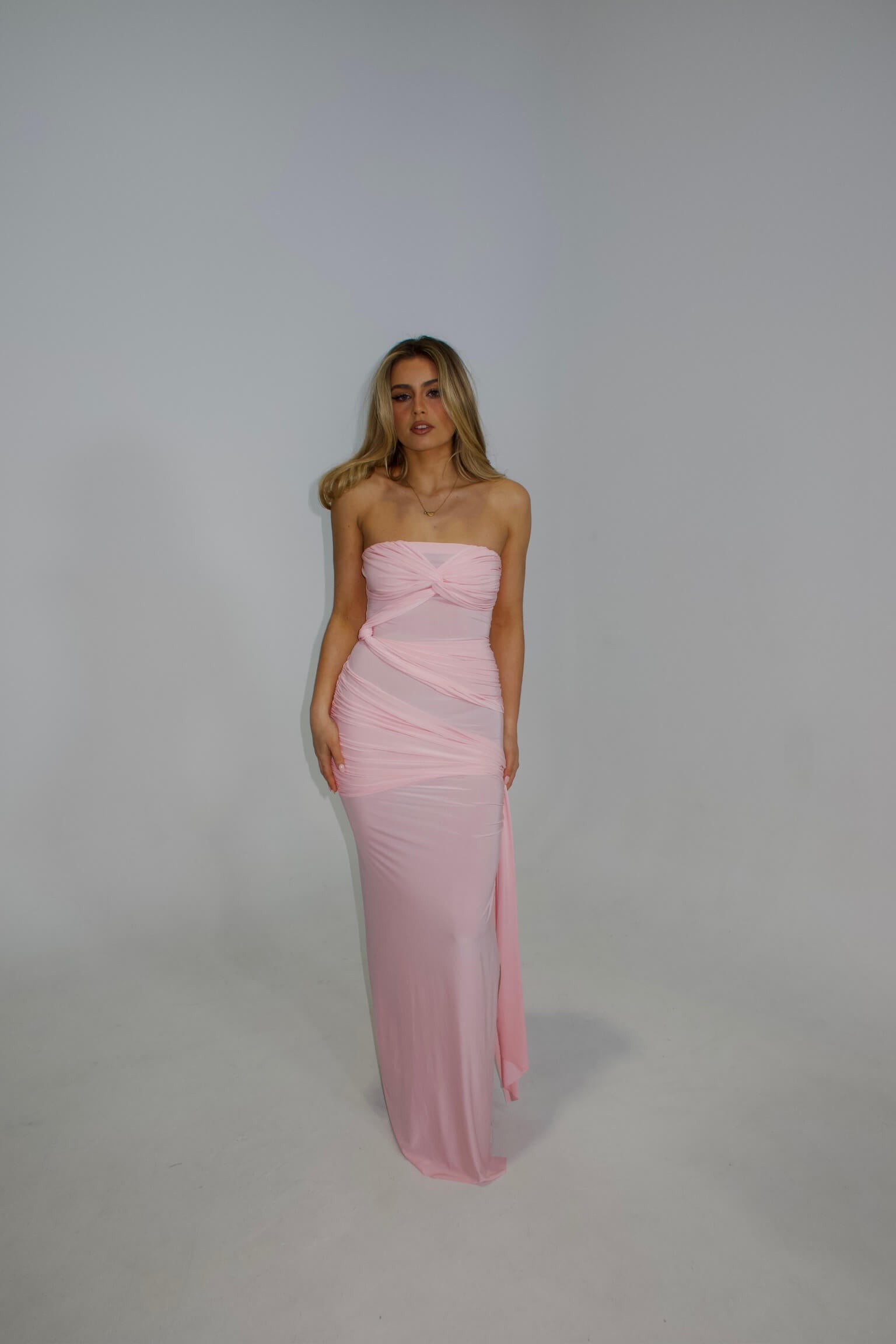 Natalie Rolt Miranda Gown in blossom pink featuring an elegant full-length silhouette and flowing design