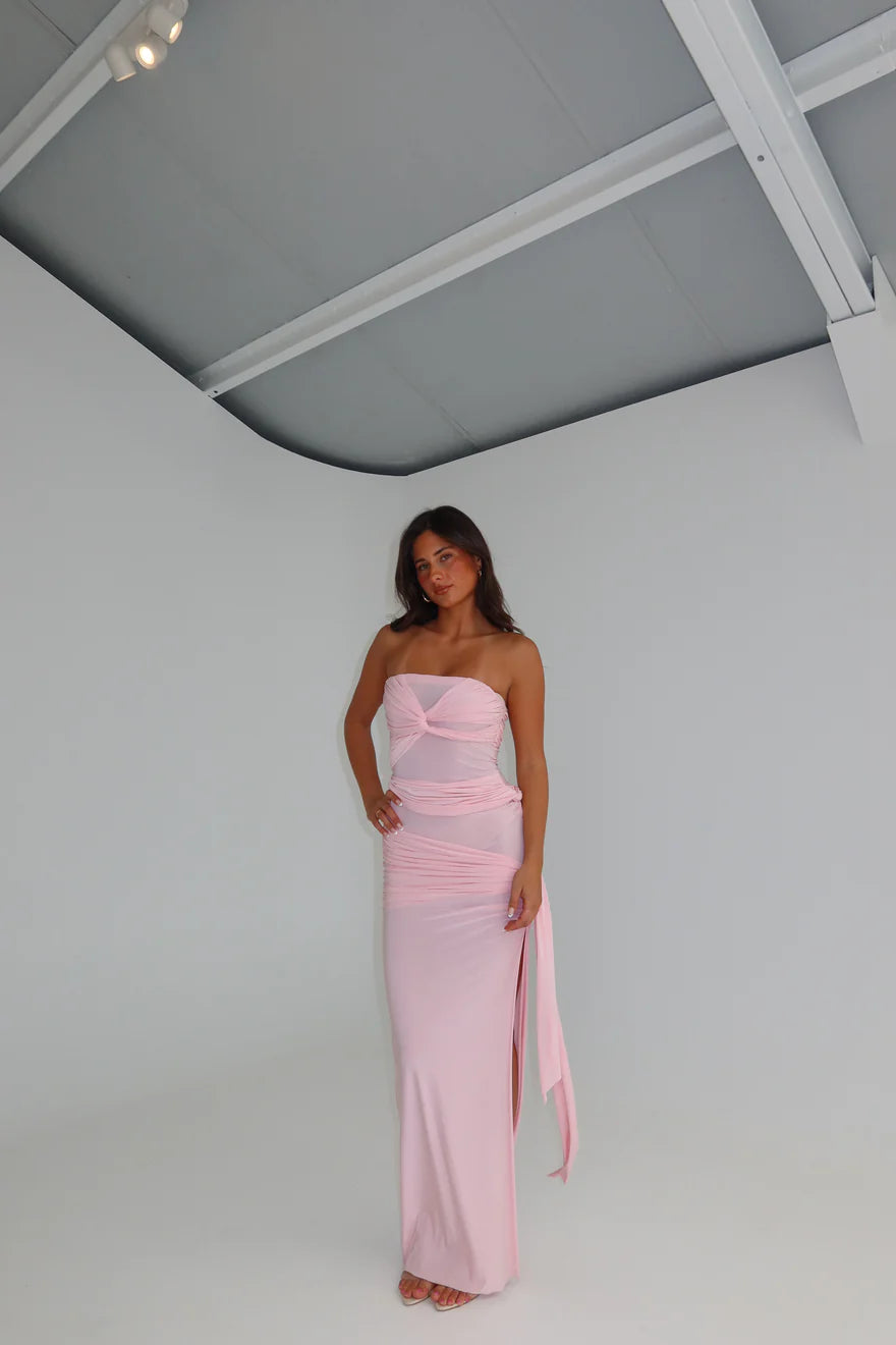 Close detail of waist on blossom pink maxi gown showing sculpted fit, ruched fabric and elegant contouring through the silhouette