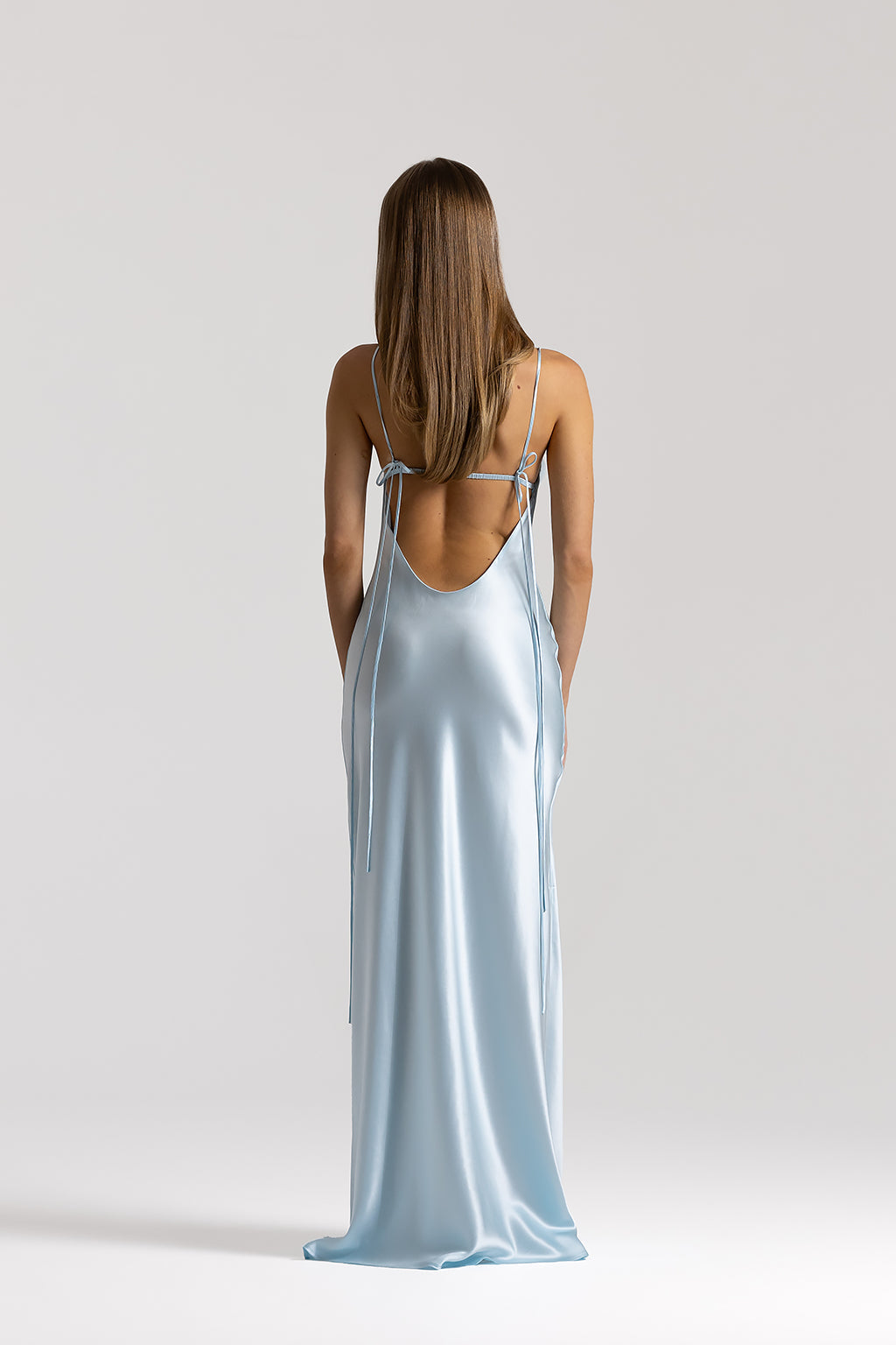 Natalie Rolt Talia Gown in Ice Blue, back view showing dipped open back and ruched detail, designer gown hire Adelaide Australia