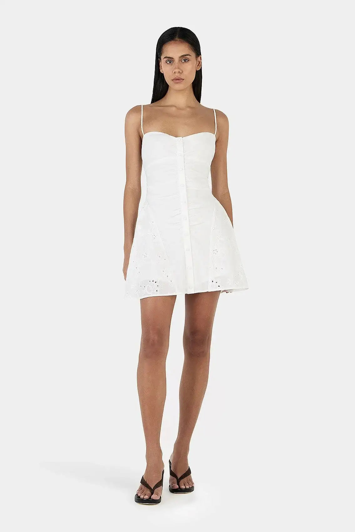 Ownley Yash Mini Dress in white anglaise featuring strapless neckline, fitted bodice and embroidered cotton fabric with a feminine mini silhouette