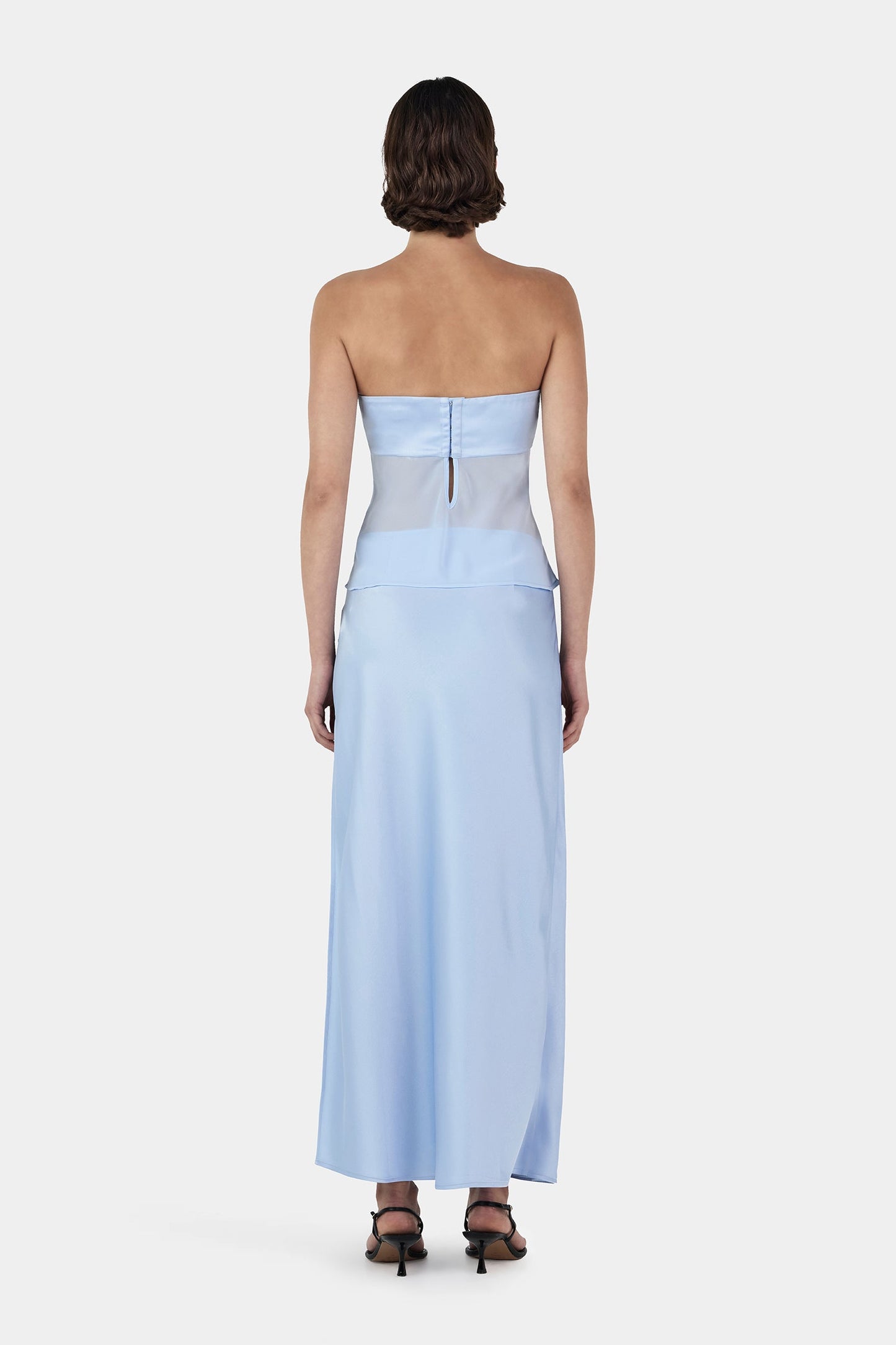 Back view of Ownly Ricky Skirt and Patrice Top Set in baby blue showing keyhole back detail and flowing skirt silhouette