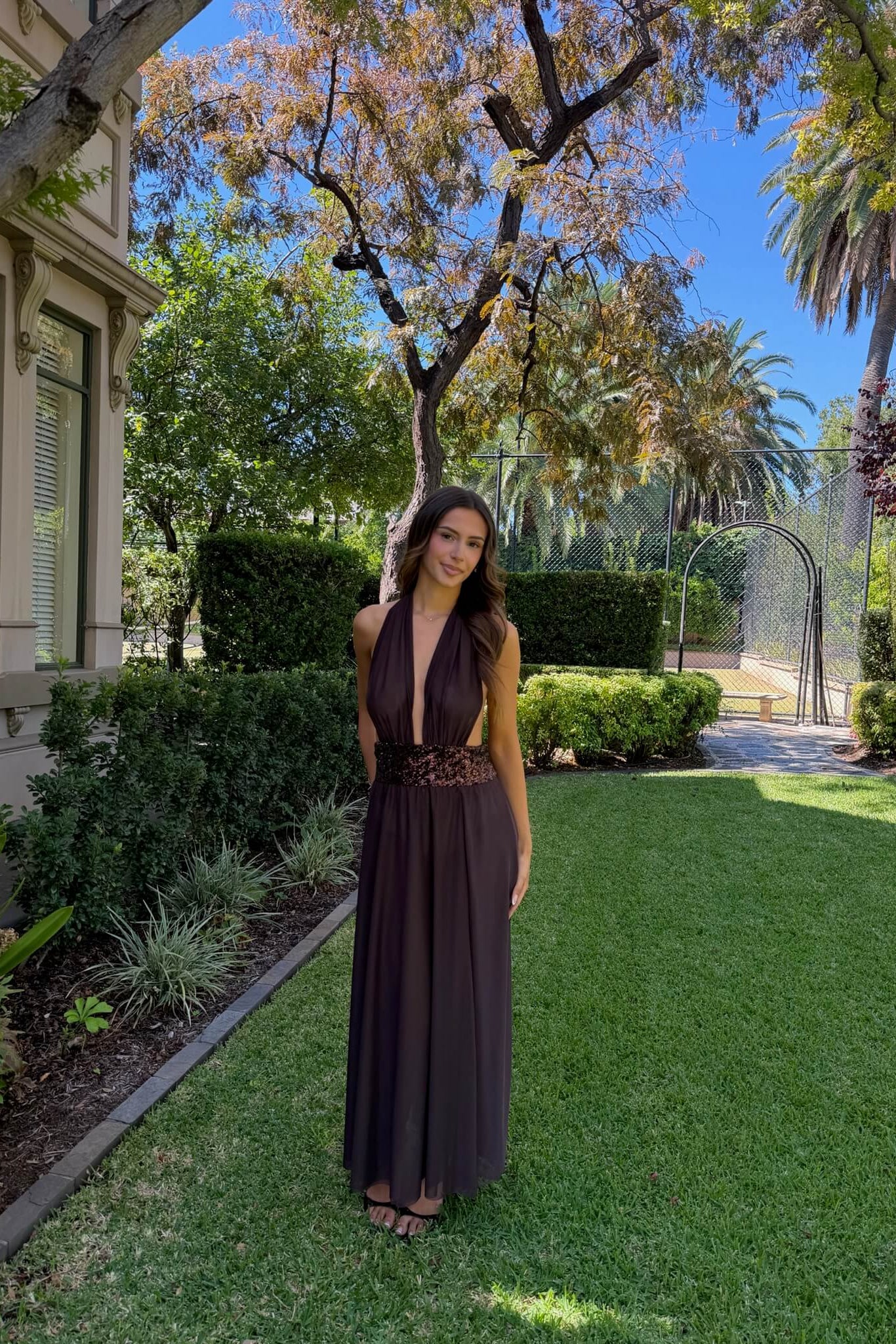 Saboa Studios Alessandra Maxi Dress in brown featuring an elegant full-length silhouette and sophisticated evening design