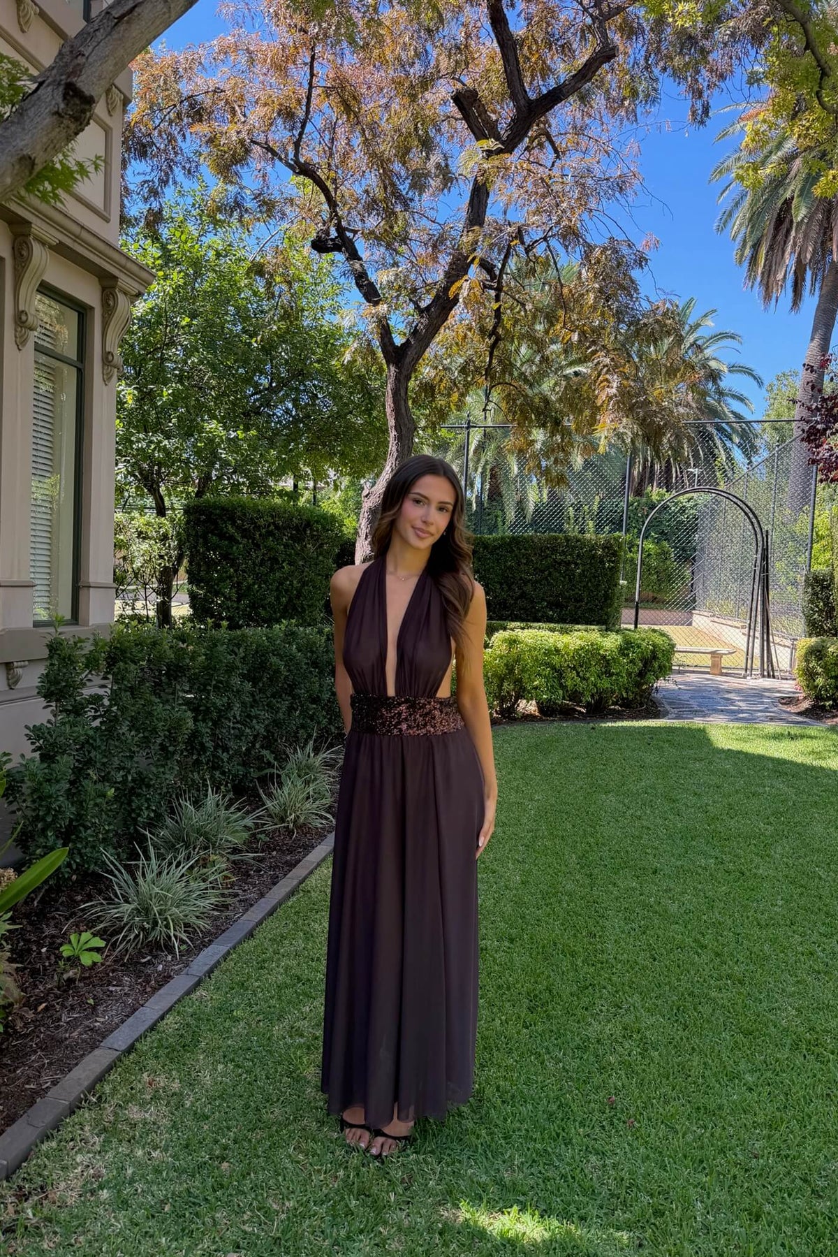 Saboa Studios Alessandra Maxi Dress in brown featuring an elegant full-length silhouette and sophisticated evening design