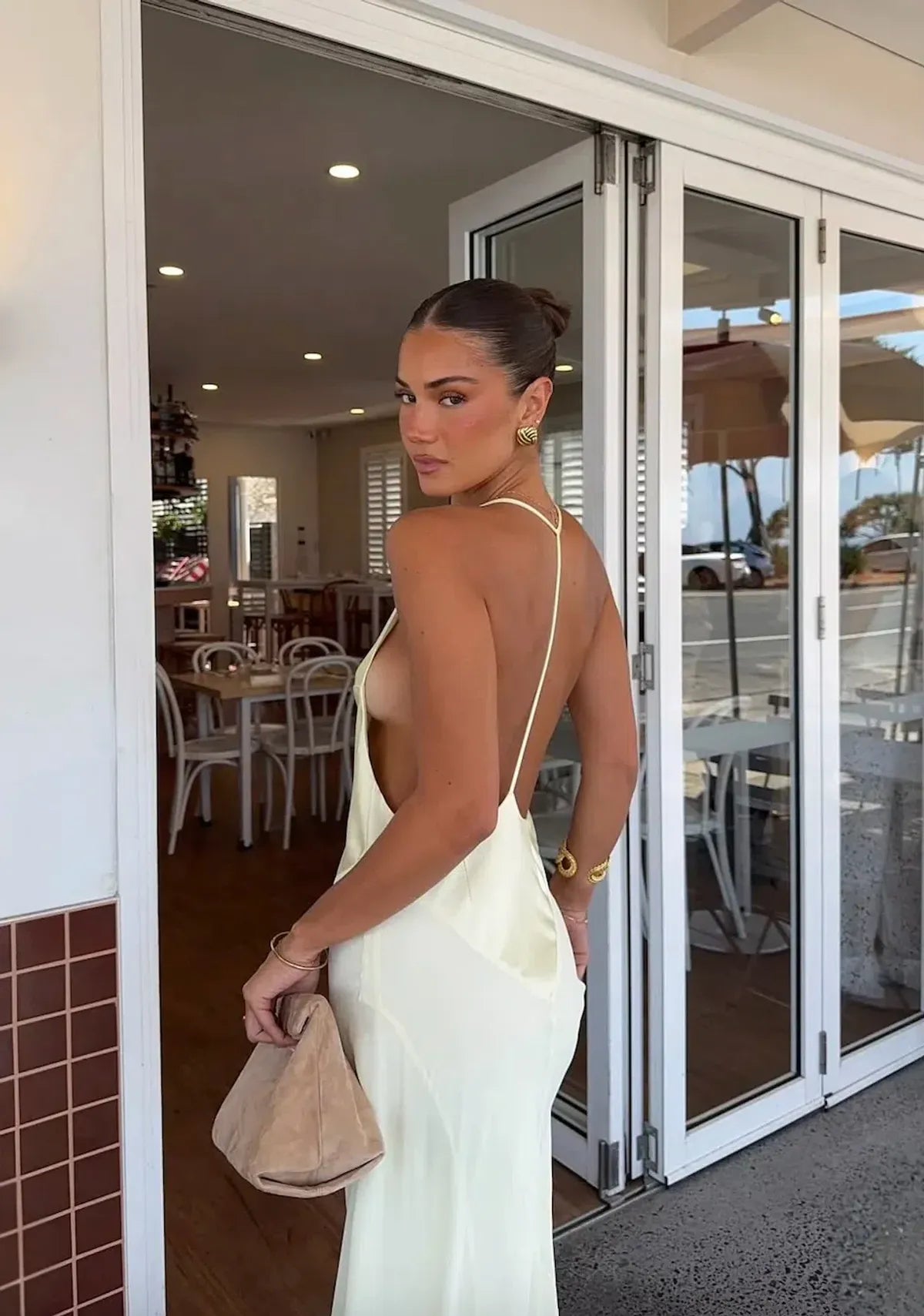 Back view of Sneaky Link Jaz Hand V Neck Maxi Dress in yellow featuring open back design and smooth flowing finish