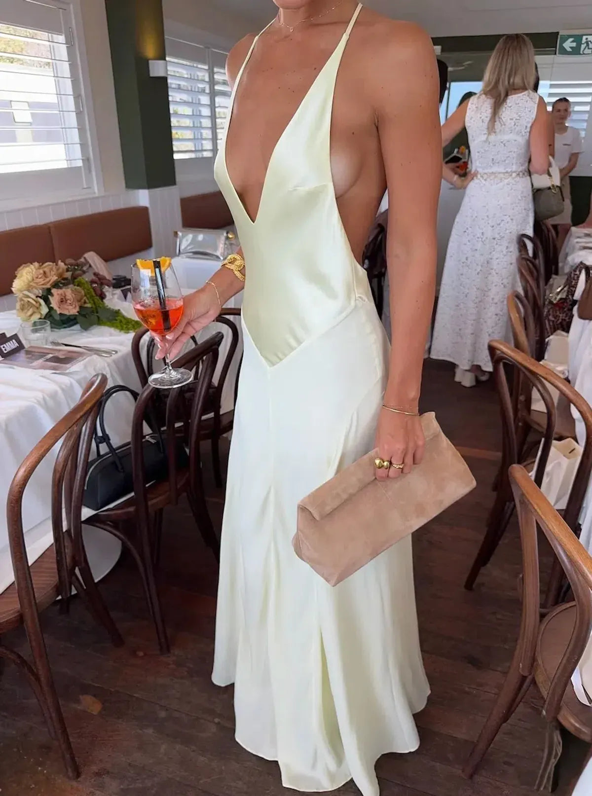 Close up of V neckline and bodice on yellow Sneaky Link maxi dress showing soft draping and lightweight fabric structure