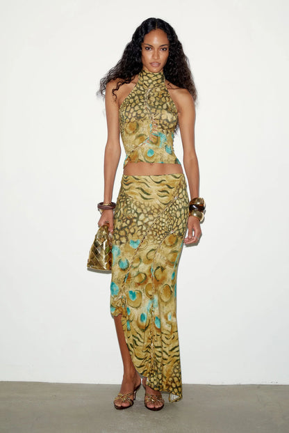 THE KRIPT Soline Skirt featuring an asymmetric hem and low-waist midi silhouette