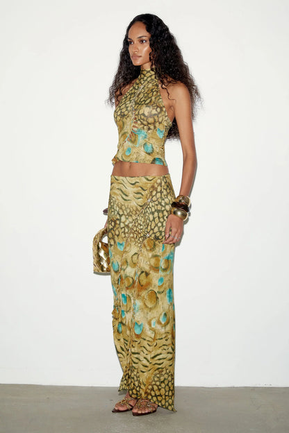 Side view of THE KRIPT Soline Skirt showing its fitted stretch silhouette and asymmetric hem for hire adelaide