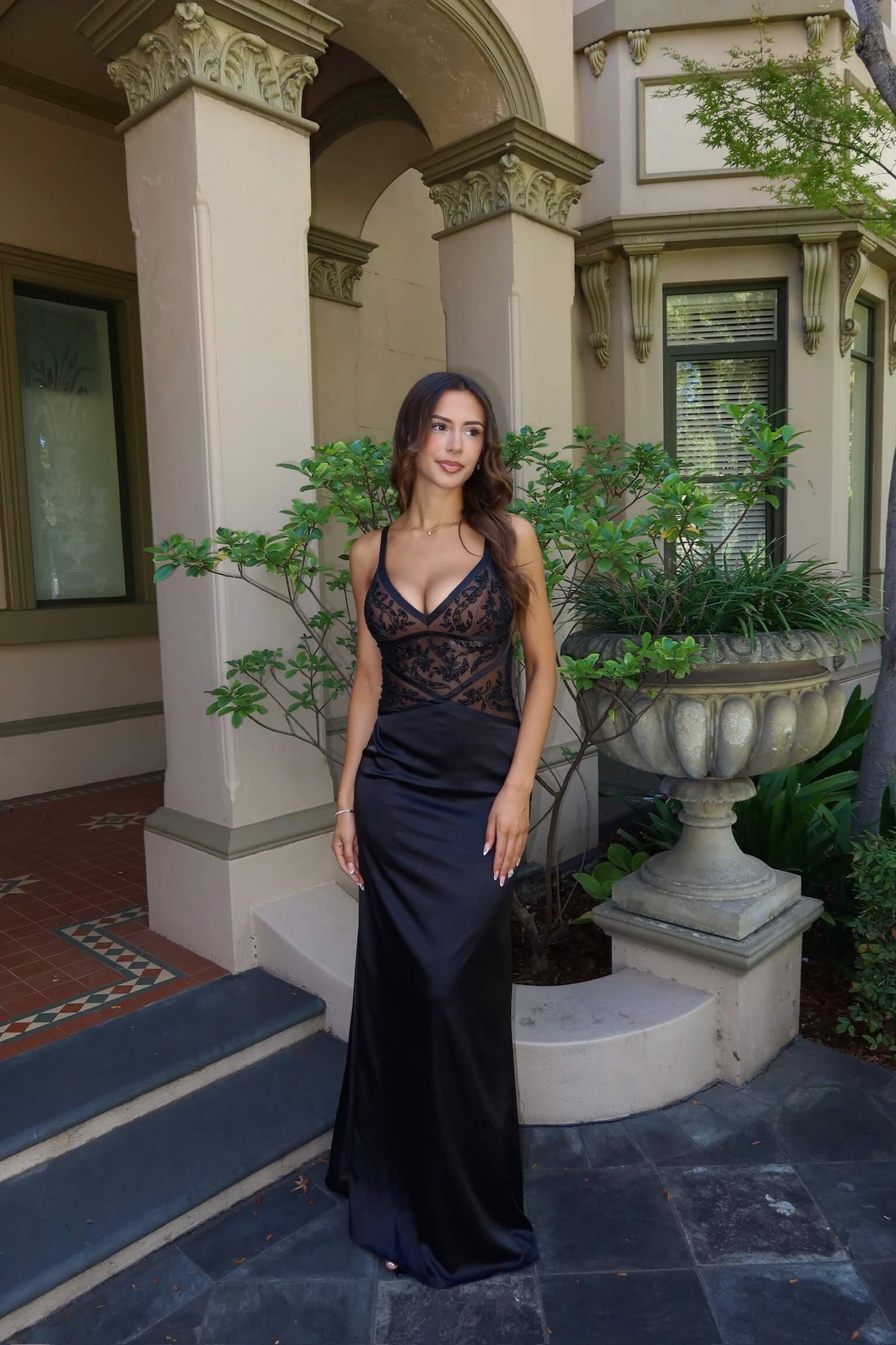 Vintage Beaded Formal Dress featuring intricate beadwork and an elegant full-length silhouette
