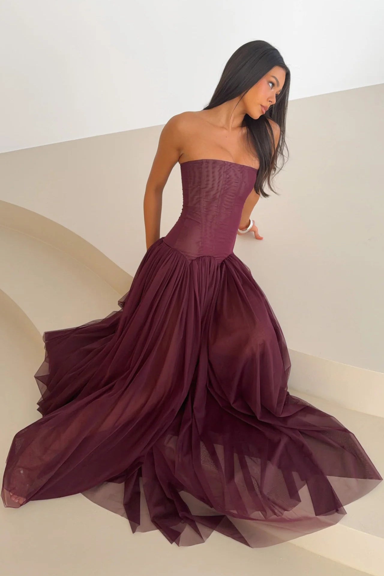 Fig coloured strapless maxi dress with corset inspired bodice, drop waist design and full length flowing skirt